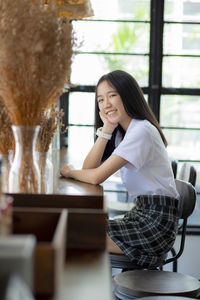 Portrait of smiling young woman