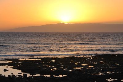 Scenic view of sea against sky during sunset