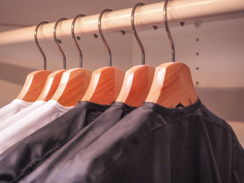 Close-up of clothes hanging on rack