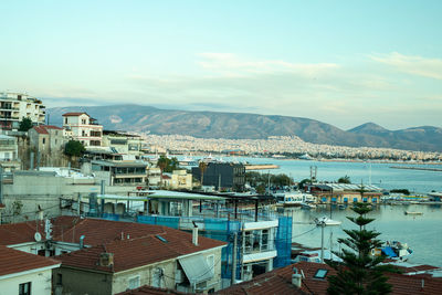 High angle view of townscape by sea