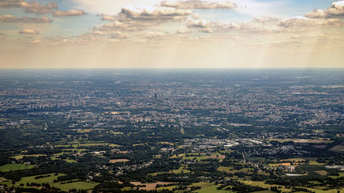 Aerial view of city buildings against sky