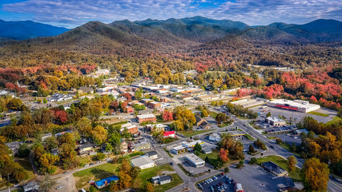 High angle view of trees and buildings against sky