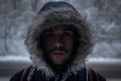 Portrait of man wearing hood during winter