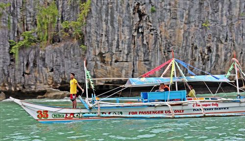 People in boat on sea