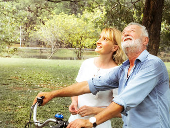 Happy couple kissing against blurred background