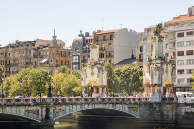 View of buildings in city against clear sky