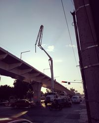 Construction site against sky in city