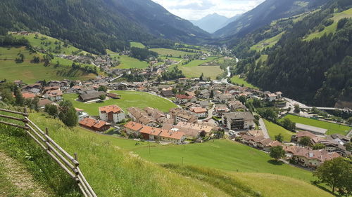 Panoramic view of houses and buildings against mountains