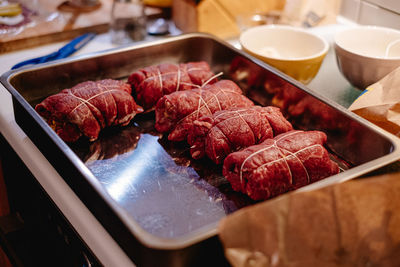 Close-up of prepared beef roulade in casserole dish on table