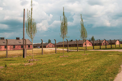 Traditional windmill on field against sky