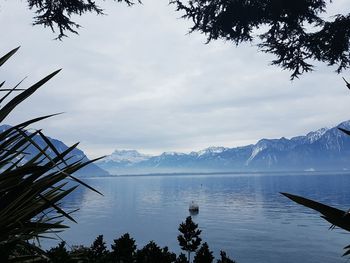 Scenic view of lake against cloudy sky