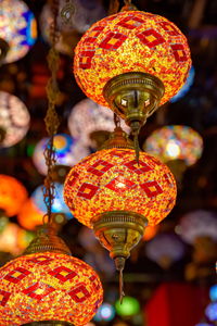 Low angle view of illuminated lanterns hanging in market
