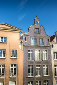 Low angle view of building against blue sky
