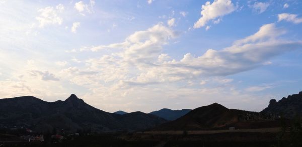 View of mountain range against cloudy sky