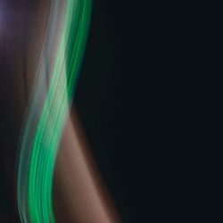 Close-up of glass over black background