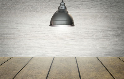 Close-up of illuminated lamp on wall