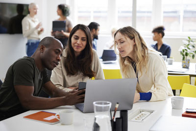 Group of business people discussing project in office