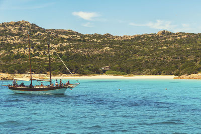 Sailboat in sea against sky