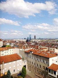 High angle view of buildings in city against sky