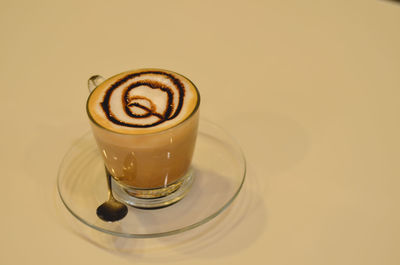 Close-up of coffee cup on table