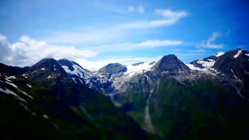 Scenic view of snow mountains against sky