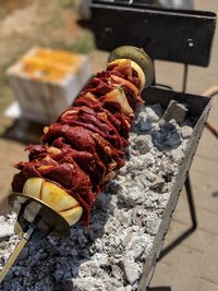 High angle view of meat on barbecue grill