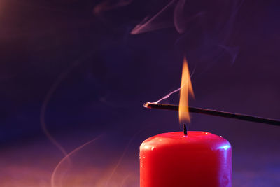 Close-up of lit candle