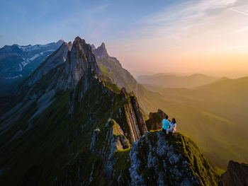 Panoramic view of mountain range against sky during sunset