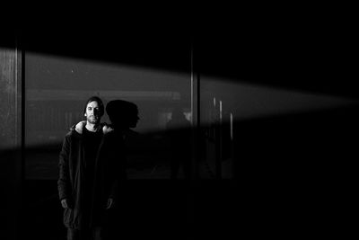 Full length of woman standing by railing