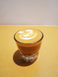 Close-up of coffee cup on table