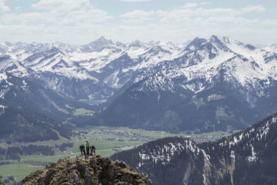 Scenic view of snow covered mountains against sky