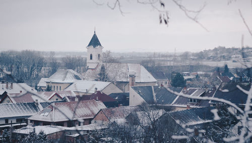 Cityscape against sky during winter