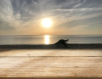 Wooden board empty table in front of nature background. perspective brown wood over on the beach
