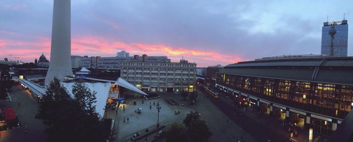 High angle view of street and buildings against sky during sunset