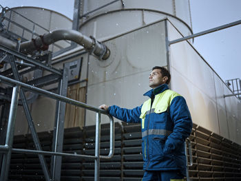 Rumania, radauti, woodworking, worker checking standing in front of blast furnace