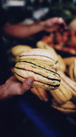 Close-up of hand holding ice cream