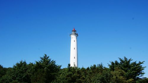 Low angle view of lighthouse against clear blue sky