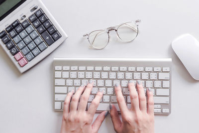 Directly above shot of person using laptop on table