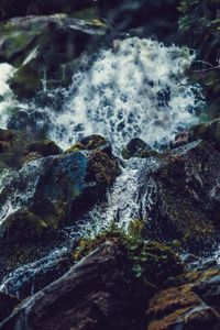 Close-up of waterfall along rocks