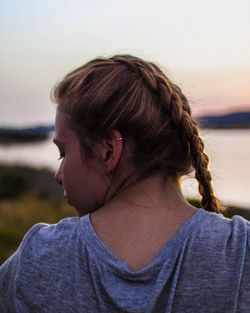 Rear view of woman against sea