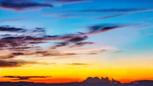 Low angle view of dramatic sky during sunset