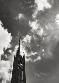 Low angle view of building against cloudy sky