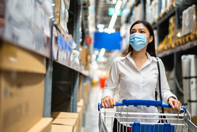 Portrait of woman standing in store