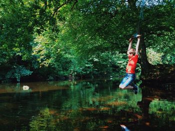 Woman standing in forest