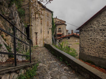 Street amidst buildings against sky