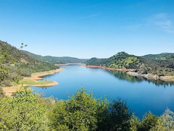 High angle view of lake against blue sky