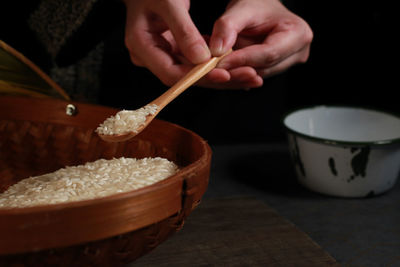 Close-up of hand holding bowl