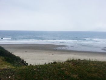 Scenic view of beach against clear sky