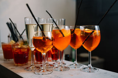 Set of cocktails and champagne in a glass on the bar table-top made for party guests.