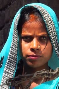 Close-up portrait of young woman wearing sari